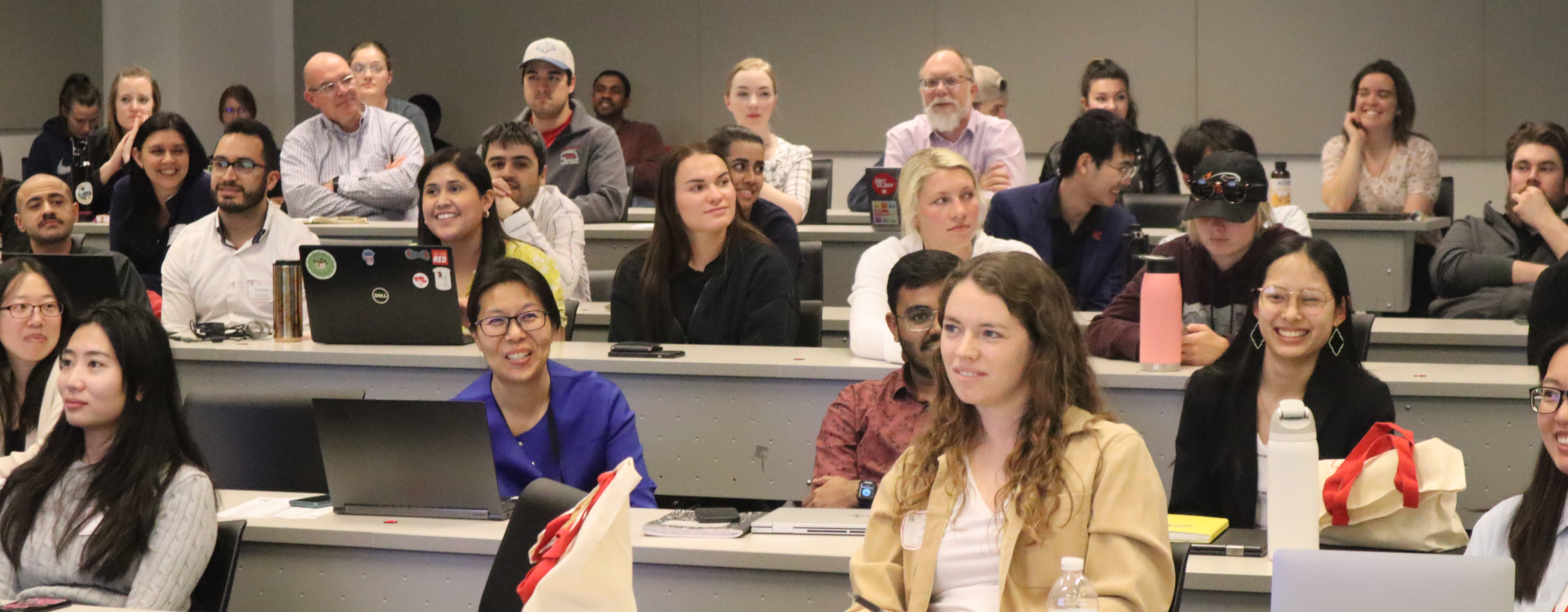 Students and faculty seated in the auditorum