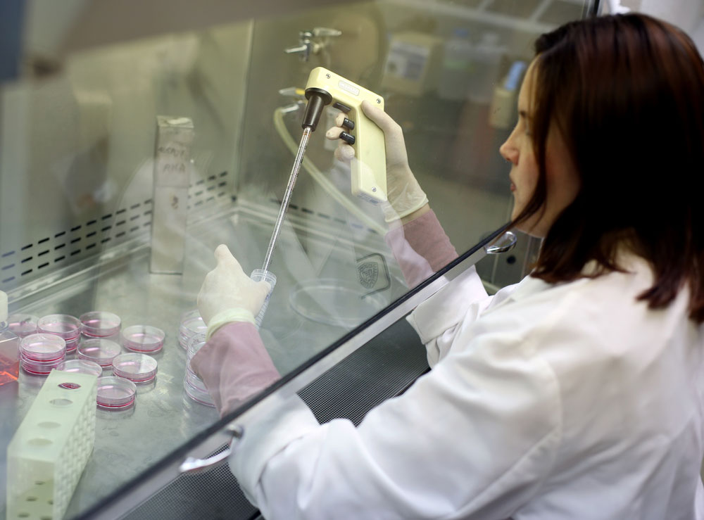 A scientist using a pipette 