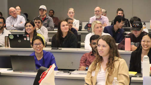 Students and faculty seated in the auditorum